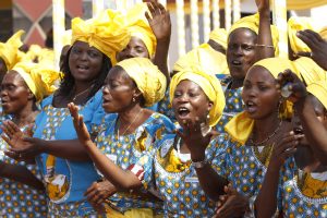 Women dance and sing as they await the arrival of Pope Benedict XVI on Nov. 18 at Cardinal Bernardin Gantin International Airport in Cotonou, Benin.