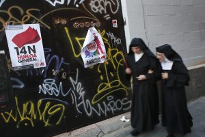 Two nuns walks past banners that read "14N, general strike" and "14N, We stop everything" in central Madrid Nov. 12. Spain's two largest labor unions called a general strike for Nov. 14, the second against the conservative government since it took power in December and coinciding with industrial action in Portugal on the same day. Two nuns walks past banners that read "14N, general strike" and "14N, We stop everything" in central Madrid Nov. 12. Spain's two largest labor unions called a general strike for Nov. 14, the second against the conservative government since it took power in December and coinciding with industrial action in Portugal on the same day.