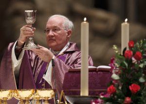 Cardinal Marc Ouellet, prefect of the Vatican's Congregation for Bishops, elevates the chalice during the opening Mass of the International Congress on the Church in America held in St. Peter's Basilica on Dec. 9 at the Vatican.