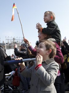 A boy watches the Pope with his telescope. PHOTO: CNS/Paul Haring