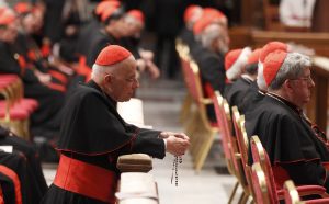 Cardinal Francis E. George of Chicago prays the rosary before a prayer service with eucharistic adoration in St. Peter's Basilica on March 6 at the Vatican. PHOTO: CNS/Paul Haring Cardinal Francis E. George of Chicago prays the rosary before a prayer service with eucharistic adoration in St. Peter's Basilica on March 6 at the Vatican. PHOTO: CNS/Paul Haring