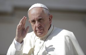 Pope Francis waves as he arrives to lead his general audience in St. Peter's Square at the Vatican June 17. Pope Francis has approved a new Vatican department which will judge bishops accused of covering up or not preventing the sexual abuse of children. PHOTO: CNS/Max Rossi, Reuters