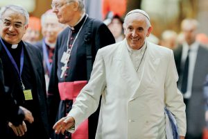 Pope Francis waves as he leaves the final session of the Synod of Bishops on the Family at the Vatican. Photo: CNS/Paul Haring