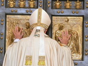 Pope Francis opens the Holy Door of St Peter's Basilica to inaugurate the Jubilee Year of Mercy at the Vatican on December 8. Photo: CNS/Maurizio Brambatti.