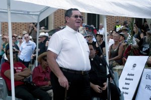 Fr Greg Donovan speaks at the Palm Sunday march, held on 20 March 2016. Photo: Supplied