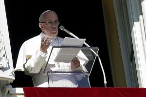 Pope Francis speaks as he leads the Angelus from the window of his studio overlooking St Peter's Square at the Vatican on 24 January. In his message for the 50th World Communications Day, the Pope urged his listeners to use the power of communication to build bridges and heal wounds, not generate hatred or misunderstanding. Photo: CNS/Max Rossi, Reuters