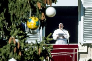 Pope Francis leads the Angelus from the window of his apartment overlooking St Peter's Square on 18 December at the Vatican. Photo: CNS/Claudio Peri, EPA