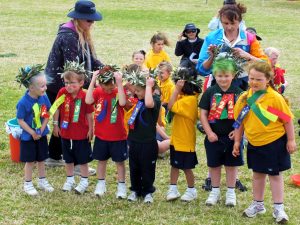 Kindy children in Lower Chittering show-off their olive branch laurel wreath.