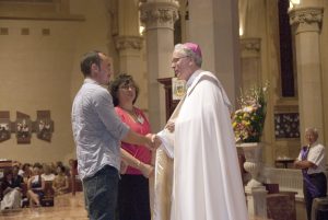 Bishop Donald Sproxton welcomes a candidate preparing to enter the Catholic Church. PHOTO: Matthew Biddle