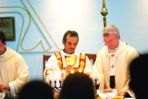 Newly ordained Deacon Victor Lujano assists Archbishop Timothy Costelloe SDB at the Mass at St Gerard Majella Parish on July 27. PHOTO: Robert hiini