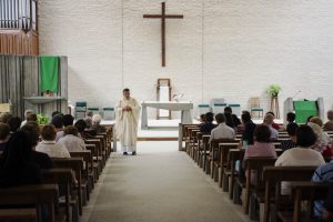 Joondanna Parish Priest Father Peter Porteous addresses the congregation during his homily. More than 150 people attended the Holy Mass and Healing session. Photo: Rachel Curry
