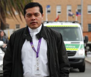 Hospital chaplain Fr Jeronimo stands outside Royal Perth where he is on call 24 hours a day to tend to the sick and dying. Photo: Peter Rosengren