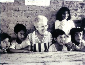 Josephite Sister Elizabeth Murphy with children of Peru. After serving as superior of her order and as head of the-then Council of National Superiors General, she sought permission to work as a missionary in Peru. PHOTO: Courtesy Josephite Sisters