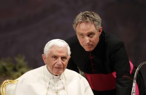 Mgr Ganswein, one of the most powerful figures in the Church, looks on with Pope Benedict XVI during a meeting in Zagreb in 2011.
