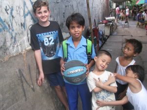 In July this year, eRecord journalist Mark Reidy took his 13-year-old son Joseph (far left) on a mission trip to the Philippines with the Holy Spirit of Freedom Community. PHOTO: Mark Reidy