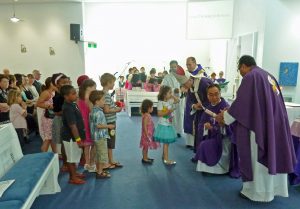 Parish priest, chaplain and deacon concelebrate Mass with the Archbishop of Perth. PHOTO: Supplied