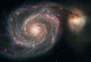 The Whirlpool galaxy and the Companion galaxy are seen in this image taken by the Hubble Space Telescope. Recent discoveries now mean science has to acknowledge the universe had a beginning, says philosopher Fr Spitzer, a Jesuit. Problem for atheists: that means a creator too.