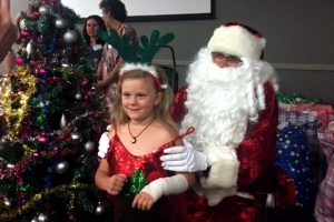 As per tradition, The Shopfront Christmas Party featured the arrival of Santa Claus, who handed out bags of gifts to all those present, giving guests - particularly children - the opportunity to sit on his lap, take photos and for those who wished to do so, exchange a few words. Photo: Supplied