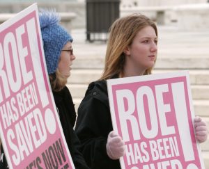 A woman holds a sign mocking U.S. President Barack Obama during the March for Life rally in 2009 on the National Mall in Washington. PHOTO: CNS/Jonathan Ernst, Reuters