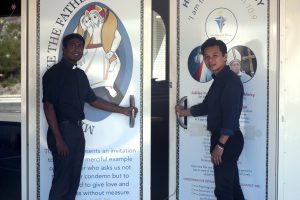 Parish Priest Fr Joseph Tran and Assistant Priest Fr Renald Anthony at the Whitford Holy Door. Photo: Caroline Smith.