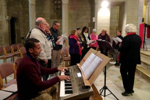 Bateman parishioners Brendan D’Sa (front left) and Angela McCarthy (front right) lead a choir practice ahead of Easter celebrations at the Ecce Homo convent in Jerusalem. Photo: Supplied
