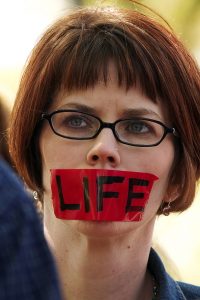 Kelsey Bohlender takes part in a silent protest March 18 in support of Schiavo on a day her feeding tube was to be removed. Kelsey Bohlender takes part in a silent protest March 18 in support of Schiavo on a day her feeding tube was to be removed.