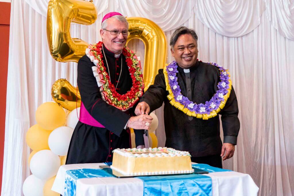 Archbishop Timothy Costelloe SDB and Midland Parish Priest Fr Benny Calanza cut the commemorative cake on Sunday 10 November. Photo: Matthew Lau.