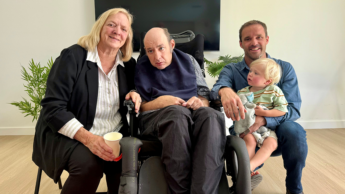 Michael enjoying a family gathering across generations.