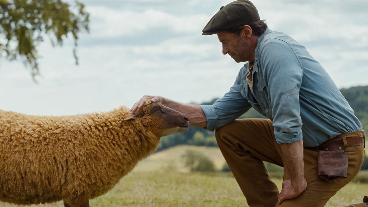 Julia-Louis Dreyfus as the voice of Lily, the sheep, and Hugh Jackman as George Hardy are pictured in a scene from the movie "The Sheep Detectives." Photo: OSV News/Amazon MGM Studios.