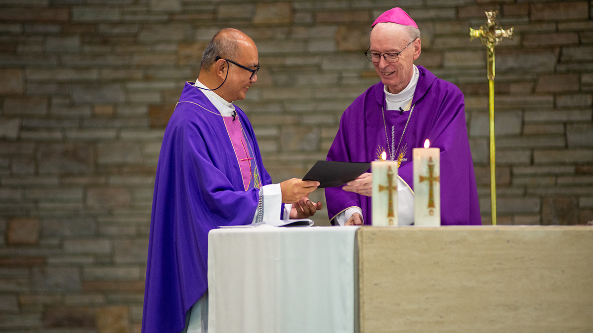Bishop Sproxton congratulates Fr Andrew on his appointment. Photo: Phil Bayne.