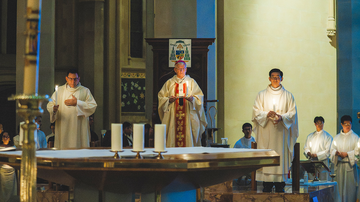 Archbishop Costelloe leads the Easter Vigil Mass at St Mary’s Cathedral. In the left foreground the ignited Paschal candle represents the risen Christ, the Light of the World.
