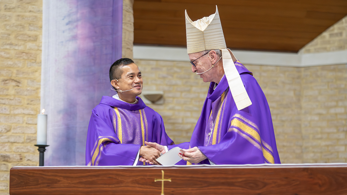 Bishop Sproxton congratulates Fr Adalbert on his appointment. Photo: Michelle Tan.