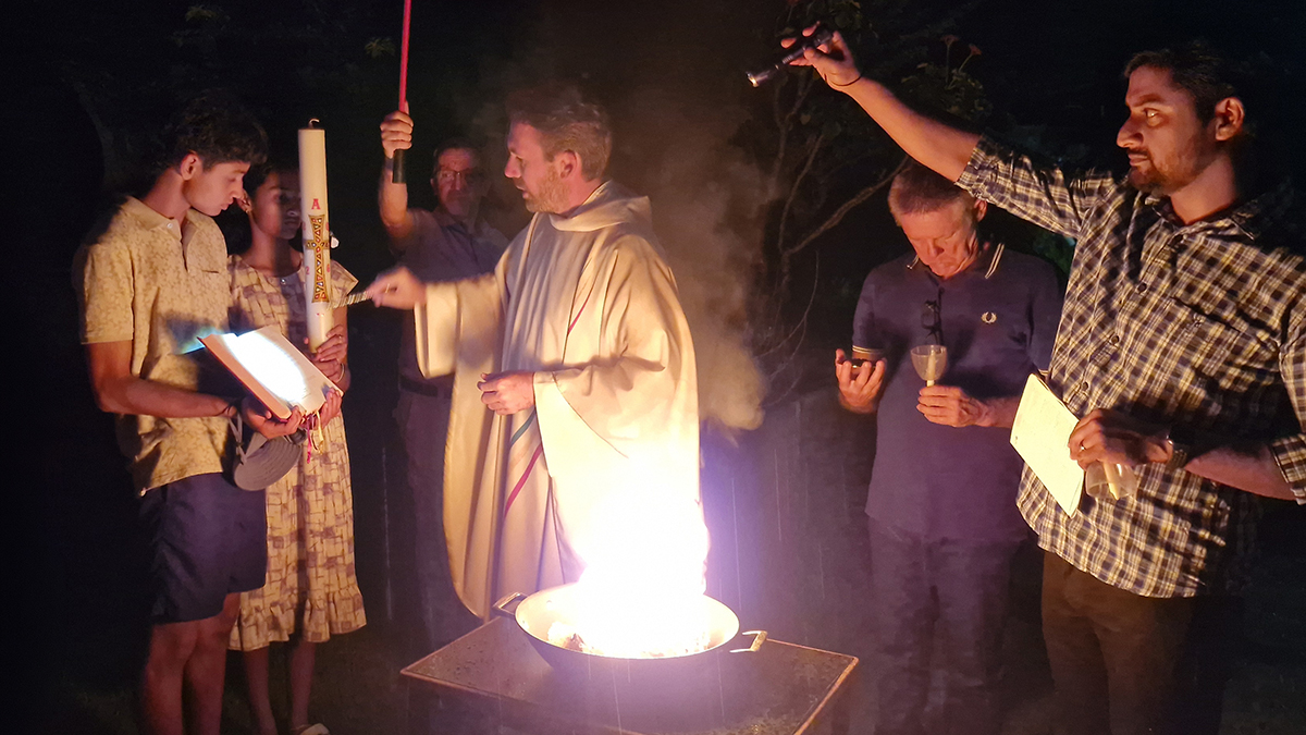 Fr Joe prepares to light the Paschal candle during the Easter Vigil. Photo: Supplied.