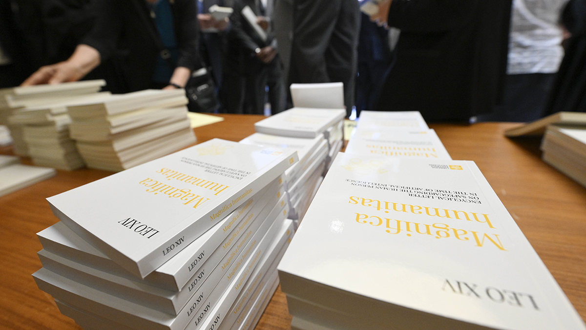 Copies of "Magnifica Humanitas" are seen at the Vatican's Synod Hall on 25 May 2026, the first encyclical of Pope Leo XIV's papacy, which focuses on the rise of artificial intelligence. Photo: OSV News/Simone Risoluti, Vatican Media.