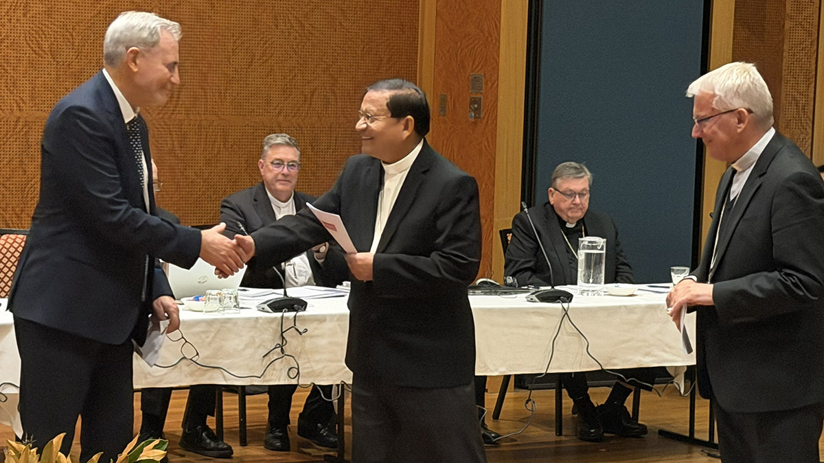 The new director of Catholic Mission in Australia, Peter Gates is congratulated by Cardinal Bo as Perth Archbishop and re-elected ACBC President Timothy Costelloe SDB looks on. Photo: ACBC.