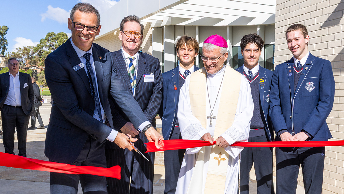 Archbishop Costelloe cuts the ribbon at the blessing and opening of the Salesian College Chadstone Mannix Campus. Photo: Supplied.