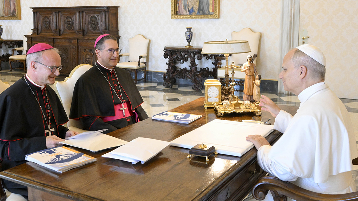 Pope Leo XIV meets with French Archbishop Thibault Verny of Chambéry, France, president of the Pontifical Commission for the Protection of Minors, left, and Colombian Bishop Luis Manuel Alí Herrera, commission secretary, right, in the library of the Apostolic Palace at the Vatican on 12 September 2025. In documents published on 13 June 2026 Pope Leo XIV approved new statutes for the commission (PCPM) that seek to balance its integration with the Roman Curia while preserving its independence. Photo: CNS/Vatican Media.