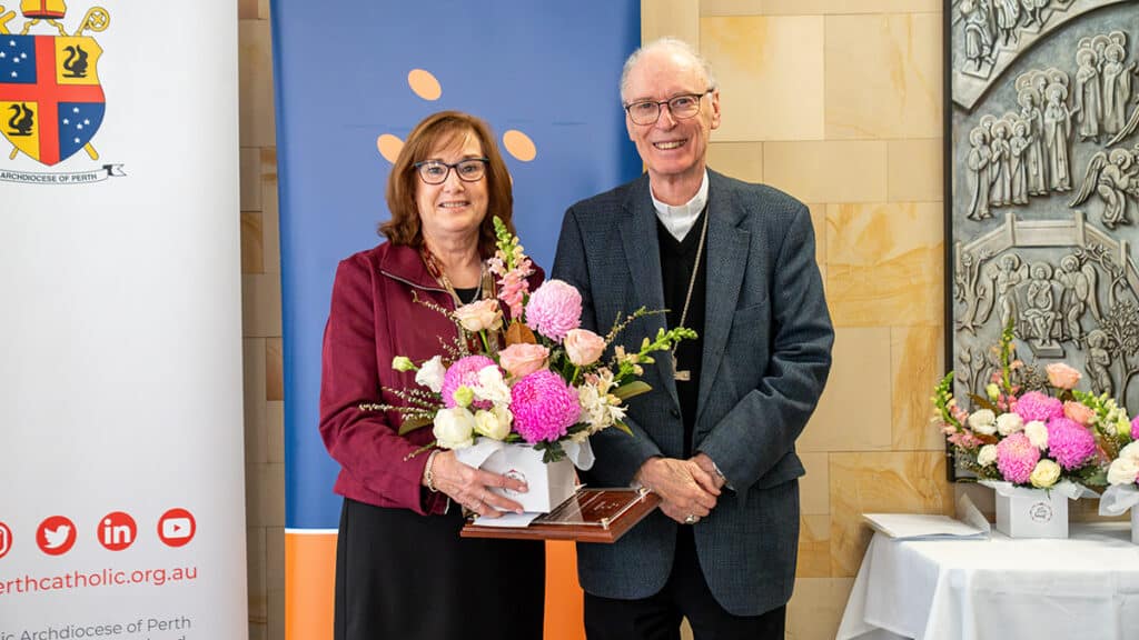 Bishop Sproxton with Catholic Homes Trinity Village Administration Officer, Carey Brown, Friday 7 August. Ms Brown was awarded the Employee of the Year Award. Photo: Eric Odong/Archdiocese of Perth.