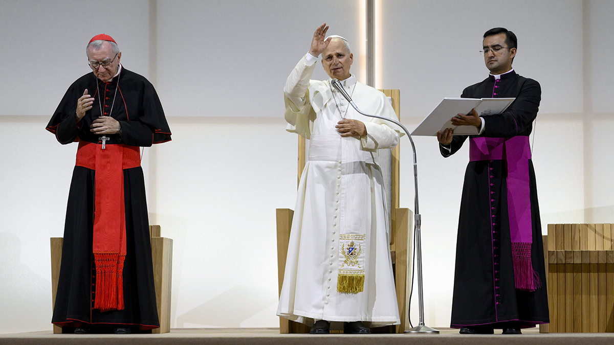 Pope Leo XIV gives his blessing to those attending the Meeting for Friendship Among Peoples, hosted by the Catholic lay movement, Communion and Liberation, in Rimini, Italy, on 22 August 2026. Cardinal Pietro Parolin, Vatican secretary of state, stands on the left. Photo: CNS/Vatican Media.