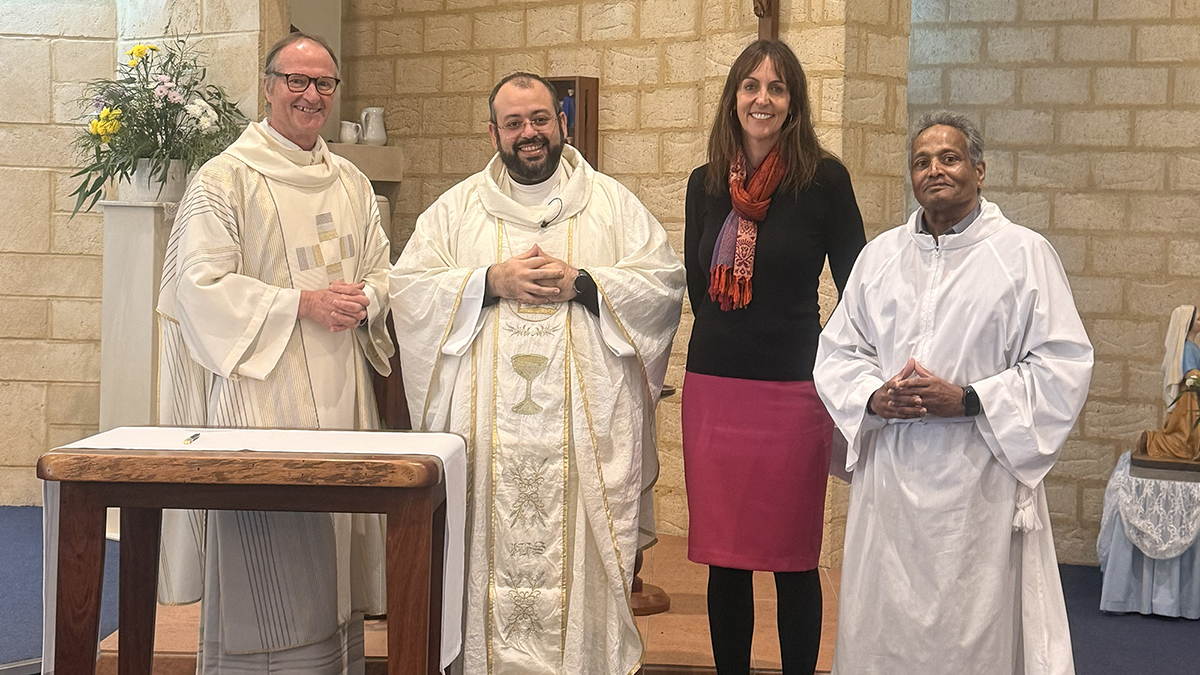 Deacon Greg Lowe, Fr Giovanni Raffaele, Deputy Principal Tracy Cosgrove and Claude Coutinho formalise the partnership. Photo: St Bernadette's Catholic School.
