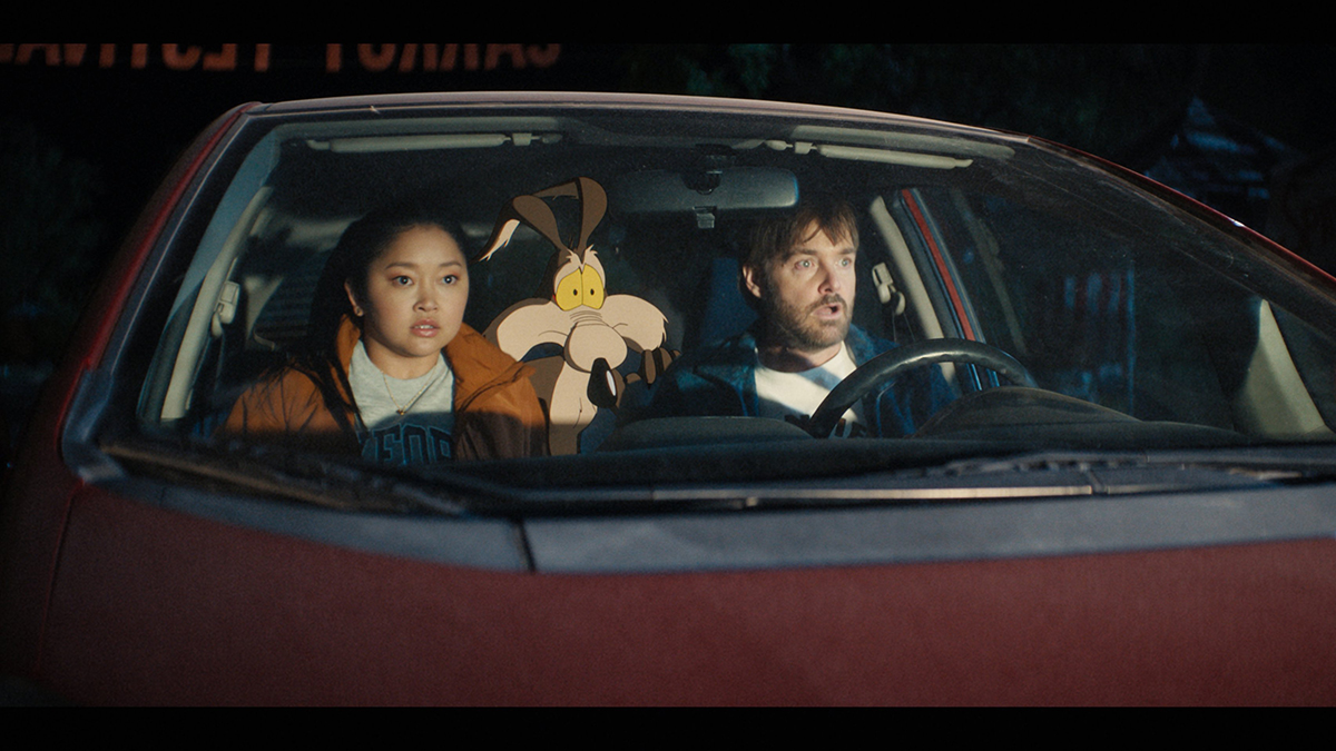 Lana Condor, Wile E. Coyote (voiced by Eric Bauza) and Will Forte are pictured in a scene from the movie "Coyote vs. Acme." Photo: OSV News/Ketchup Entertainment.