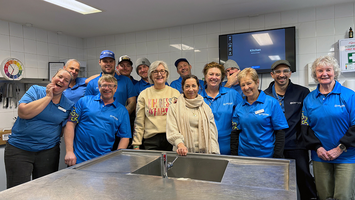 Vinnies WA CEO Ann Curran and Queens Park Regional President, Bridget de Freitas with Kelmscott Community Kitchen volunteers. Photo: Supplied.